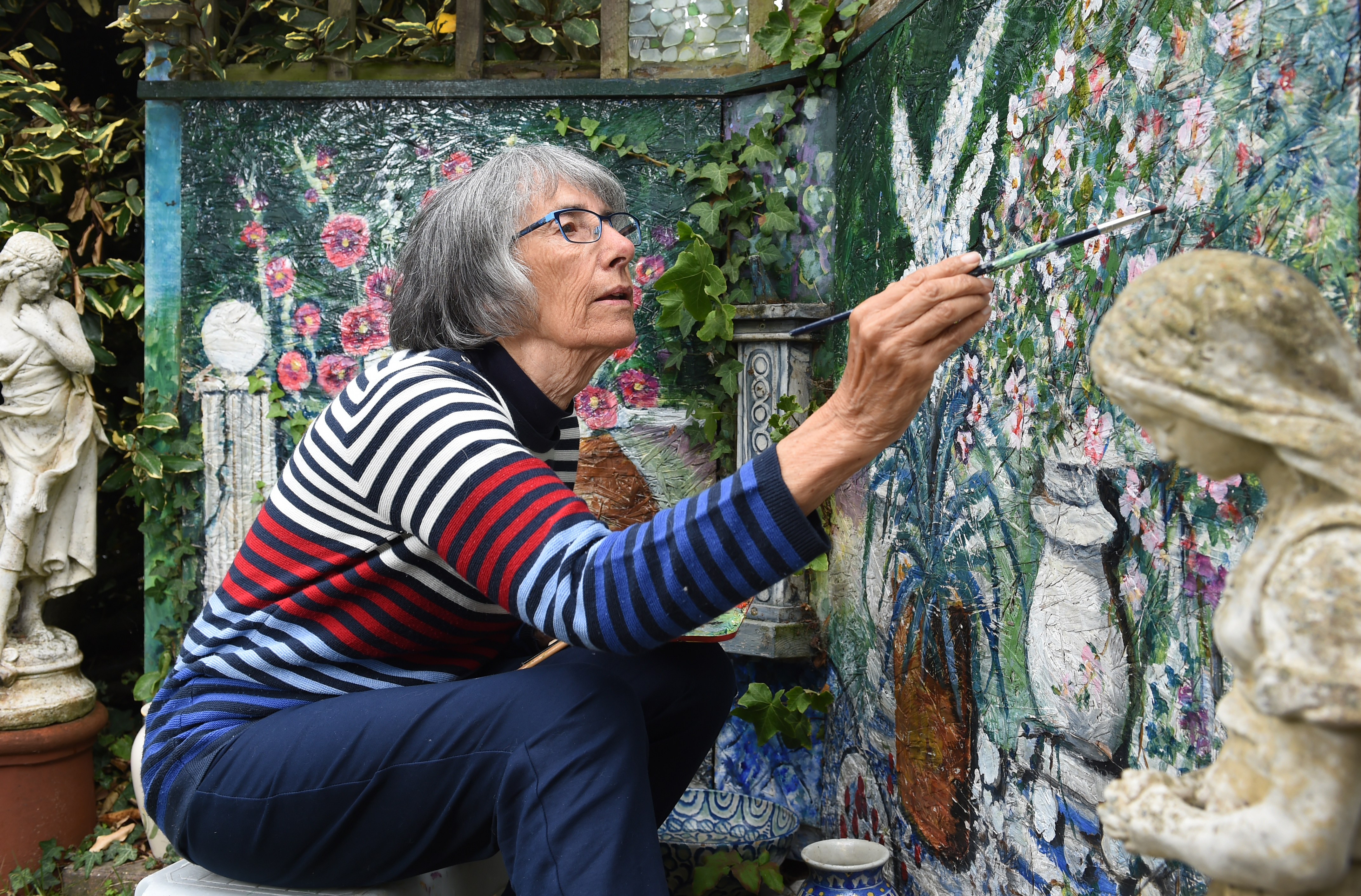 woman painting a wall