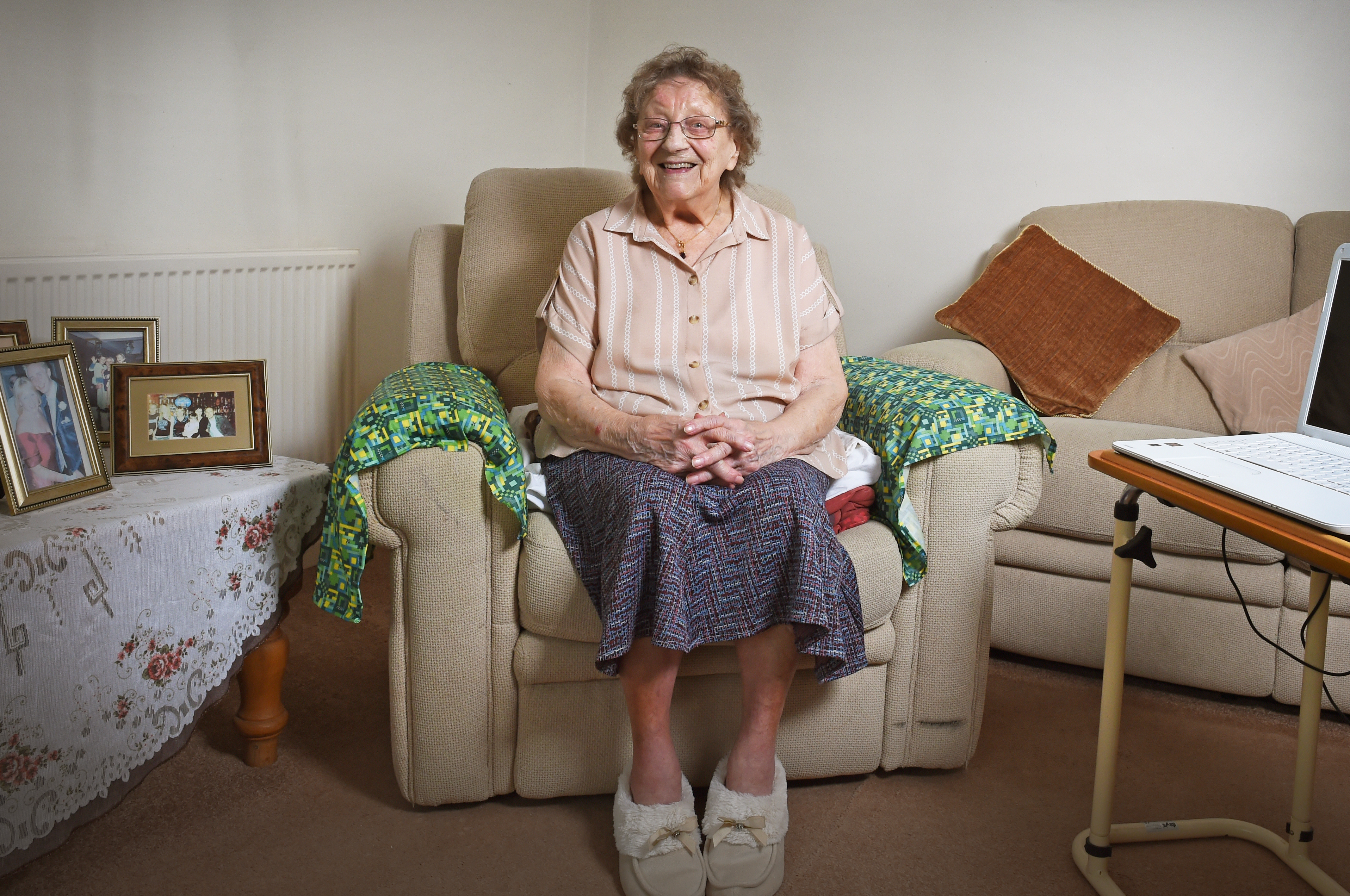 A woman sat in her living room