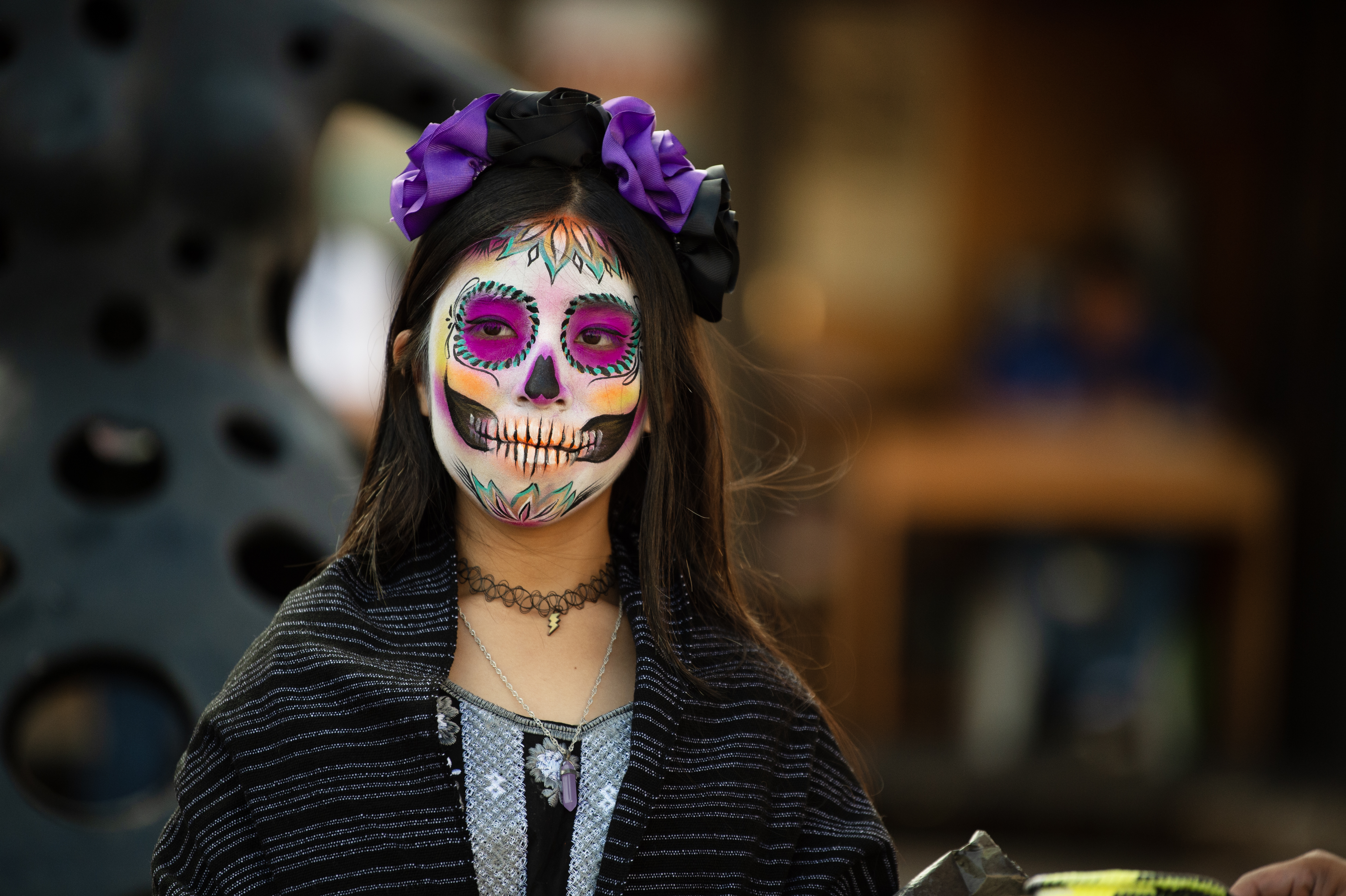 A woman with day of the dead skeleton face make-up
