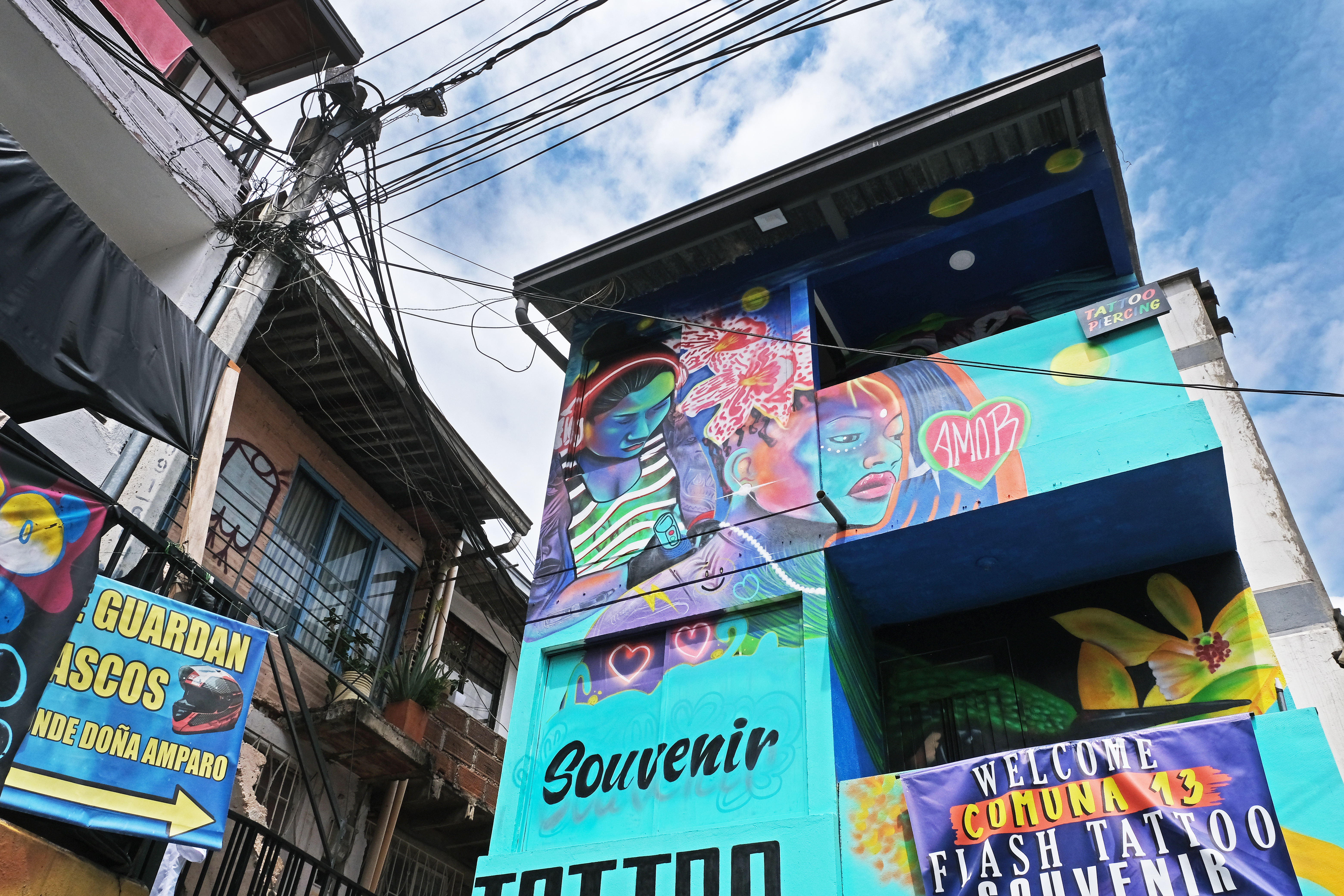 buildings in a town painted with bright blues and purples.